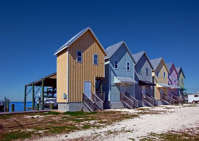 houses, row, beach, row of houses, building, residential, property, housing, architecture, neighborhood houses, sky, blue, dwelling, blue sky, realty, community, ocean, sand, nature, vacation, rental, blue community. Short-term rental software: the twelve trial tests that decide before you sign