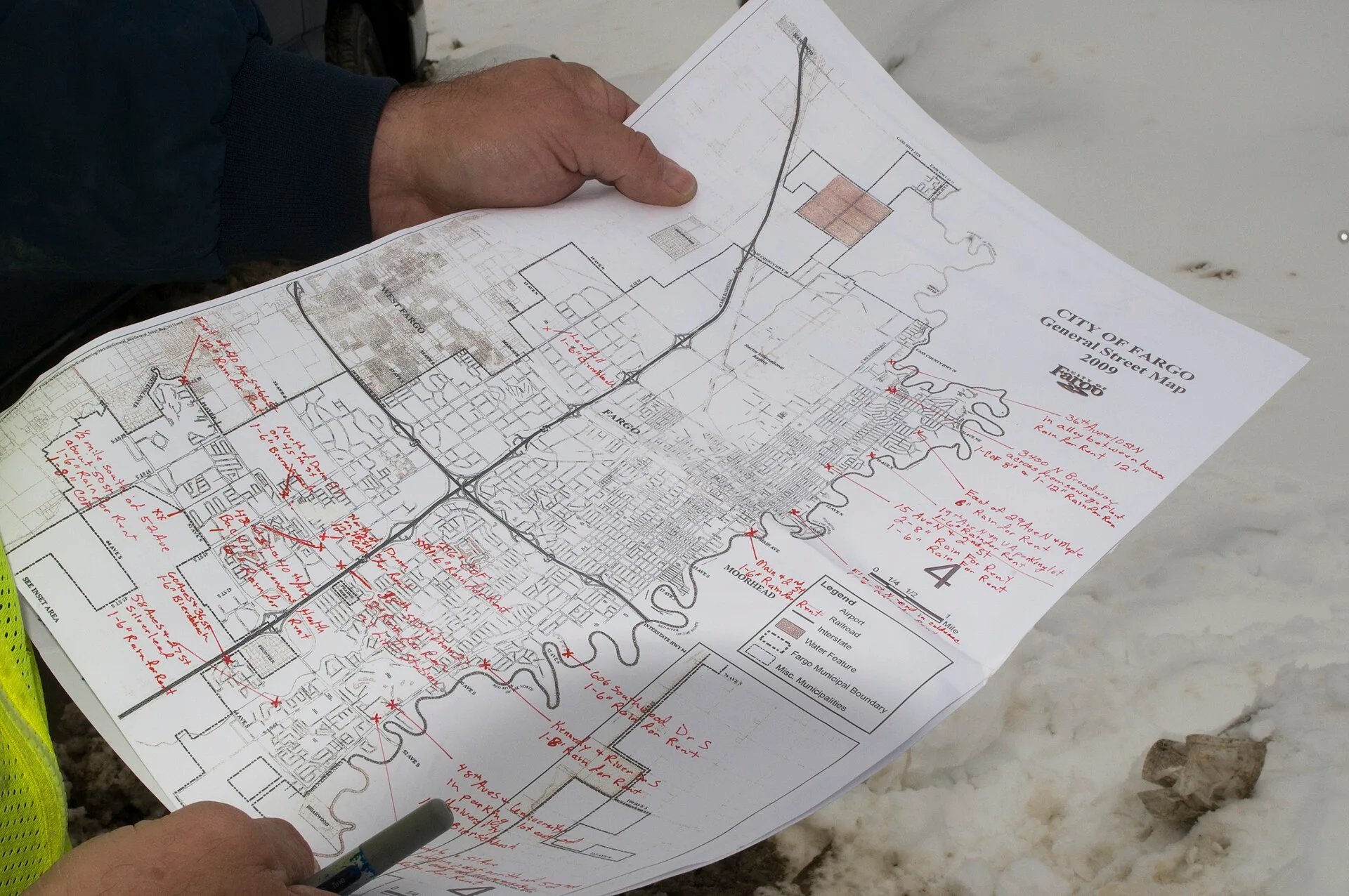 Fargo, ND, April 1, 2009 -- Harold Pedersen, the man responsible for placing and maintaining the pumps for flood control in Fargo, ND , holds a map with the location of pumps being used to control water removal. Photo by Patsy Lynch/FEMA. Flood and Fire Maps for Vacation Rental Owners: Reading Risk Before You Buy