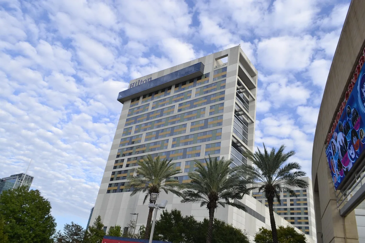building, hilton hotel, nature, palm trees, vacation, commercial, tropical, weather, clouds, city, holiday, summer, resort, relax, leisure, paradise, travel, houston, texas. Texas Short-Term Rental Taxes: An Operator Overview