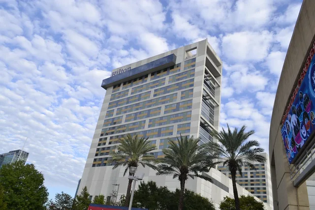 building, hilton hotel, nature, palm trees, vacation, commercial, tropical, weather, clouds, city, holiday, summer, resort, relax, leisure, paradise, travel, houston, texas. Texas Short-Term Rental Taxes: An Operator Overview